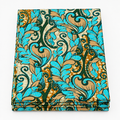 Turquoise Paisley Leaf Ankara wax print fabric, folded